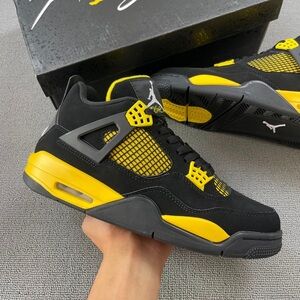 Nike Air Jordan 4 Retro GS Thunder Black and Yellow Shoes.